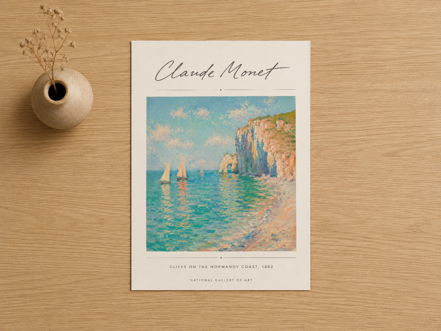 Claude Monet imzalı, turkuaz deniz ve kaya oluşumlarını gösteren sanat baskısının başlı başına görünümü.