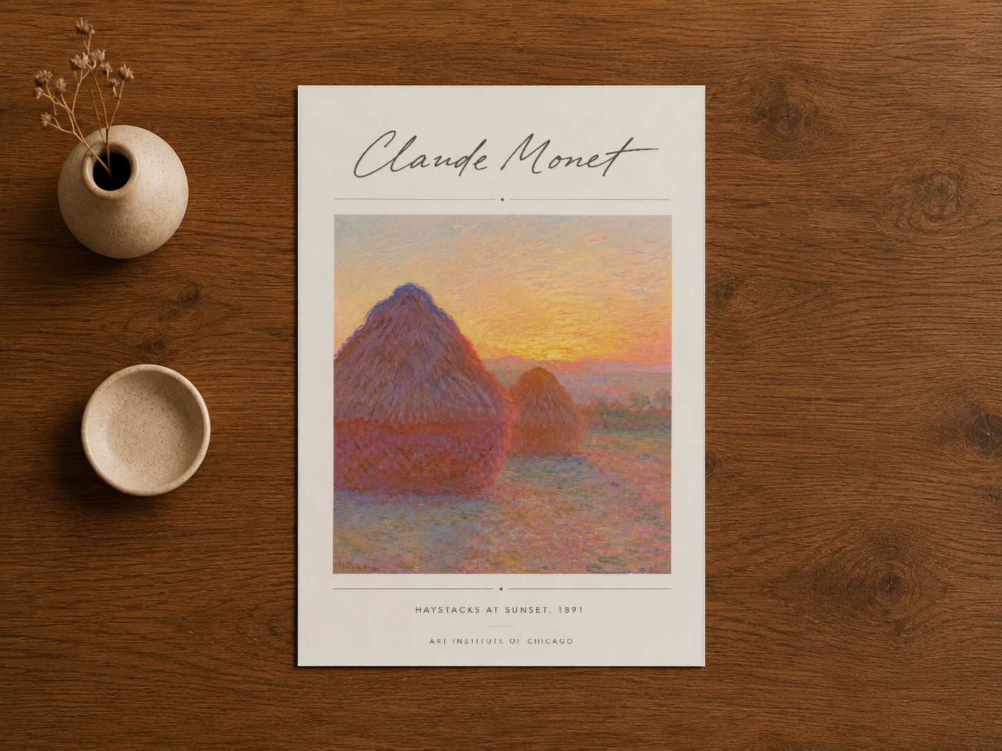 Claude Monet'nin masterpiyesi Samanlıklar, ahşap masa üstünde sanat baskısı.