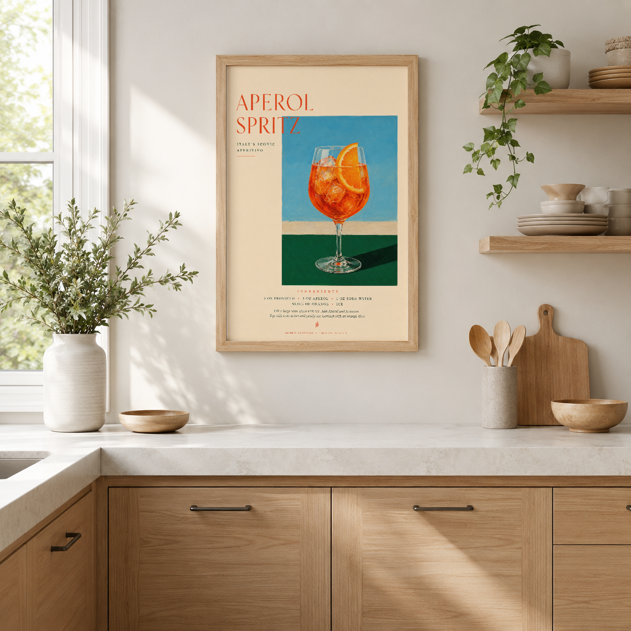 Aperol Spritz retro posteri, ahşap çerçevede, modern mutfakta taze içecek sahnesi sunuyor.