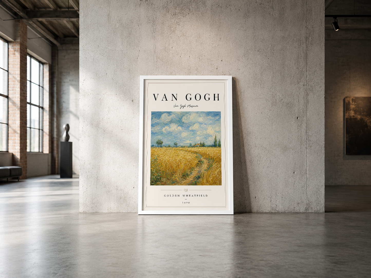 Van Gogh'un Altın Buğday Tarlası poster, beyaz çerçeveli, endüstriyel galeri mekânında zeminde sergilenmekte.