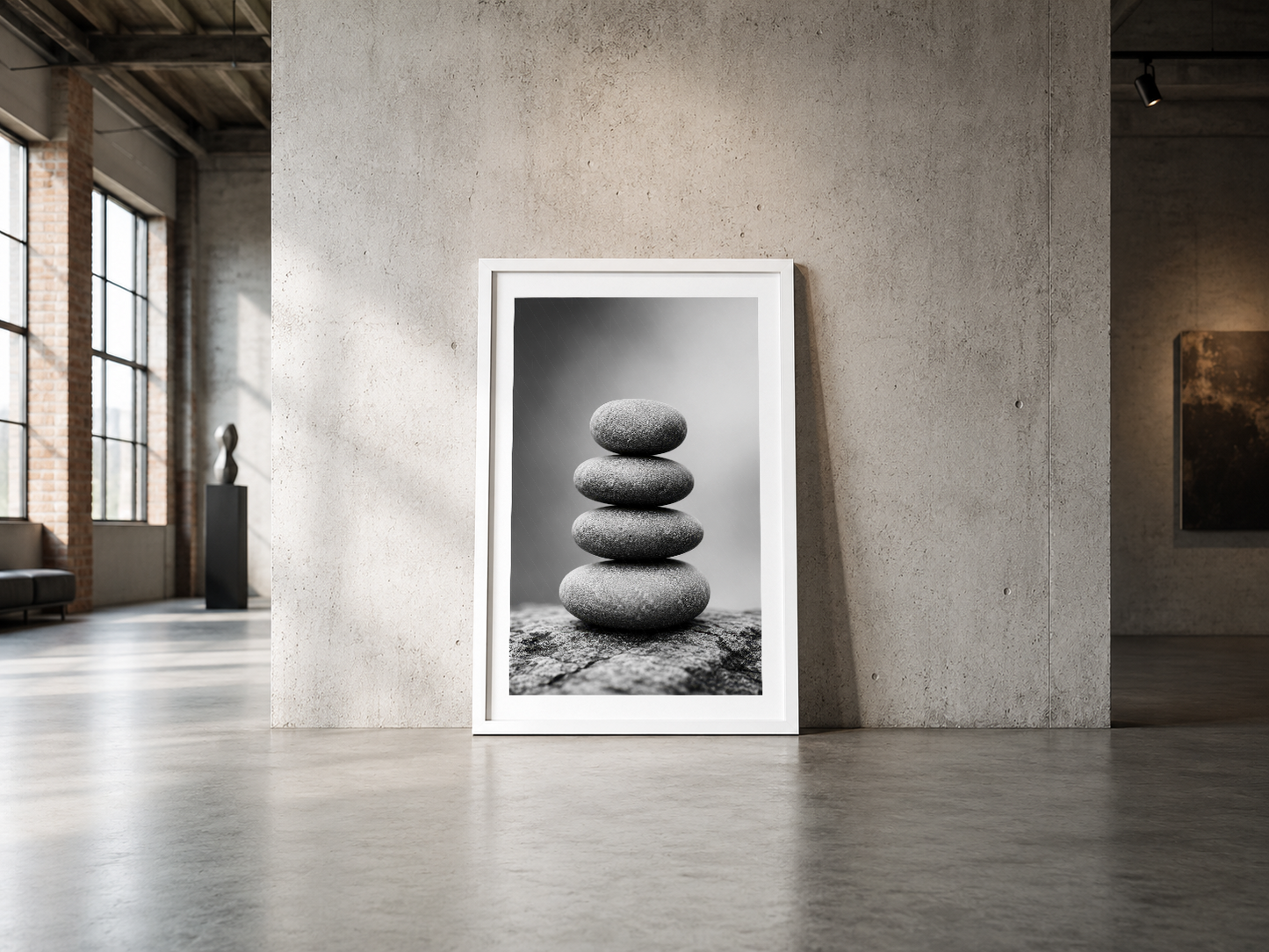Minimalist endüstriyel mekanda, stabil ve meditasyona dayalı taş yığını sanat baskısı.