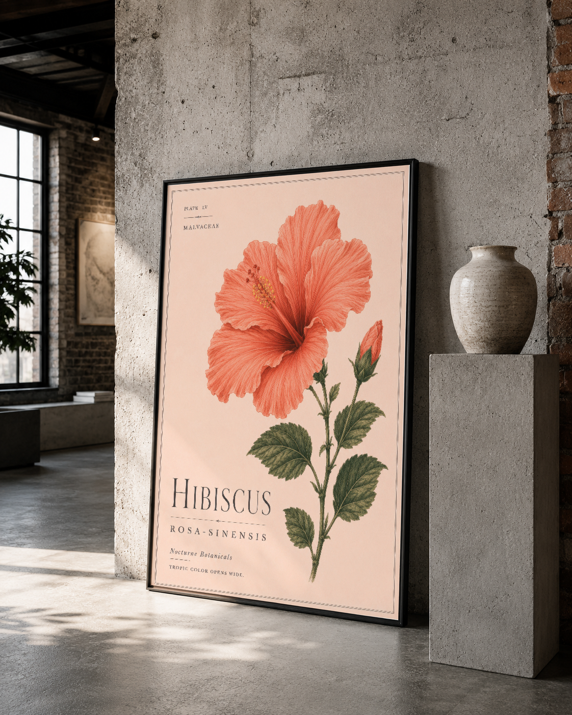 Endüstriyel tarzı mekanda siyah çerçeveli Hibiscus tablosu, açık pembe arka planda botanik ilüstrasyon.