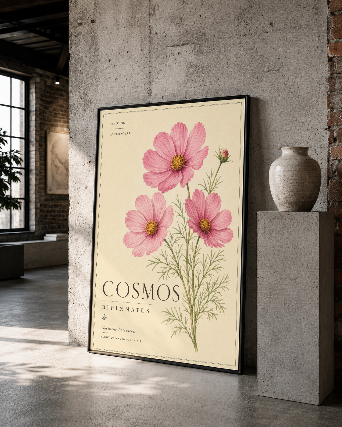 Zarif pembe cosmos baskısı siyah çerçevede, minimalist iç mimar tarzı duvar sanatı.