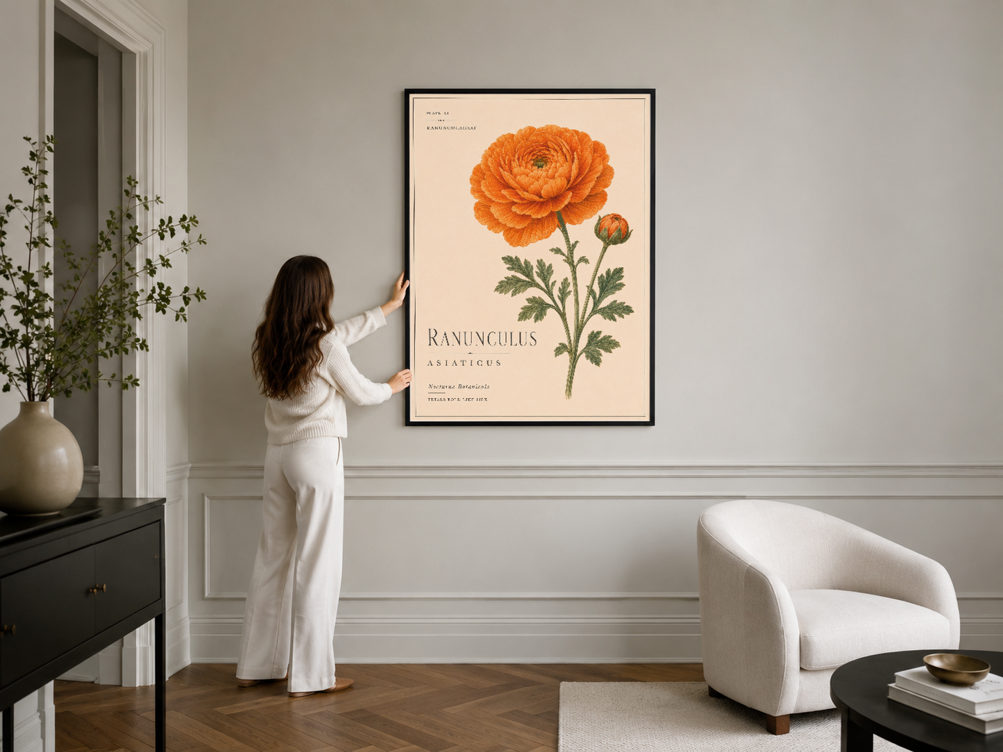 Turuncu çiçek motifli zarif duvar sanatı, siyah çerçeveli poster, minimalist iç mekanda.
