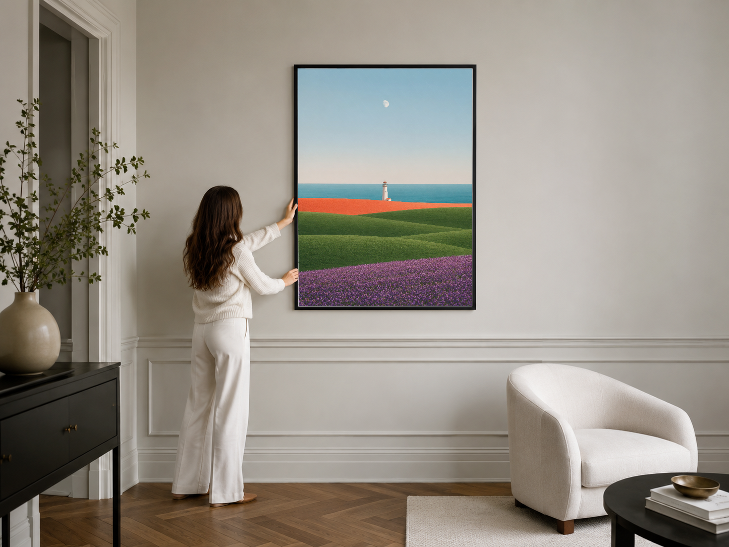 Siyah çerçeveli doğa temalı tablo, katmanlı manzarası ve pastel renkleriyle minimalist yaşam alanının odak noktası olan