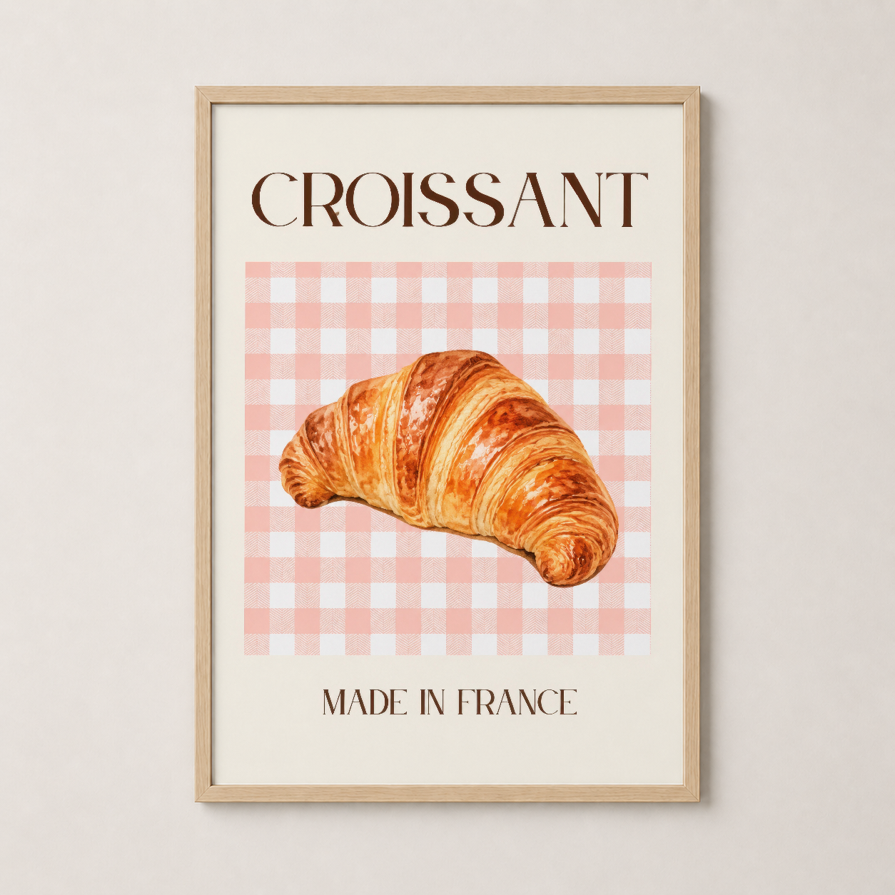 Ahşap çerçeveli vintage croissant tablosu, Fransız mutfak temasıyla rahat ve sıcak ev atmosferi yaratır.