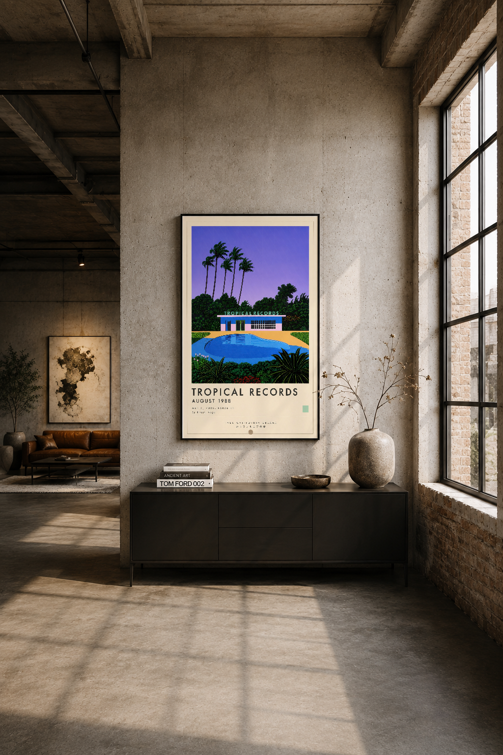 Modern endüstriyel mekanda siyah çerçeveli Tropical Records posteri, minimalist duvar dekoru olarak sergileniyor.