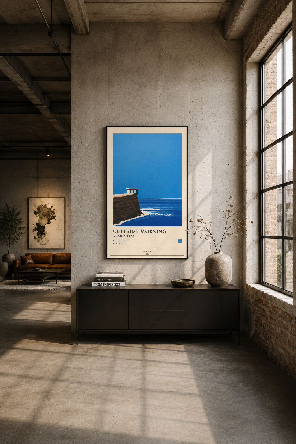 Endüstriyel loft stilinde, beton duvar üzerinde siyah çerçeveli Cliffside Morning tablosu, minimalist modern ev