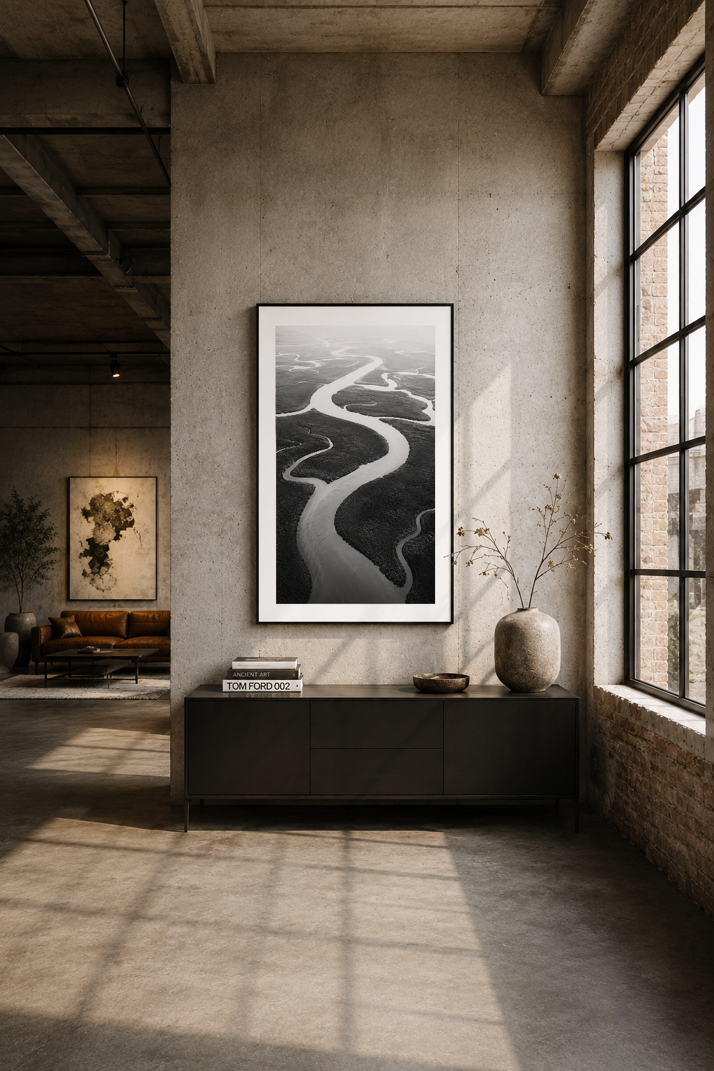 Endüstriyel loft tarzı odada, siyah beyaz nehir tablosu duvarı modern ve minimalist atmosfer yaratır.