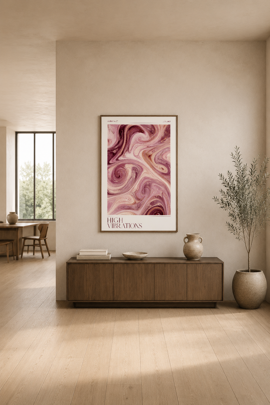 Akıcı pembe tonları içeren modern sanat tablosu, minimalist oturma alanının beyaz duvarında görkemli görünüyor.